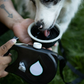 Arnés para mascotas con botella portátil